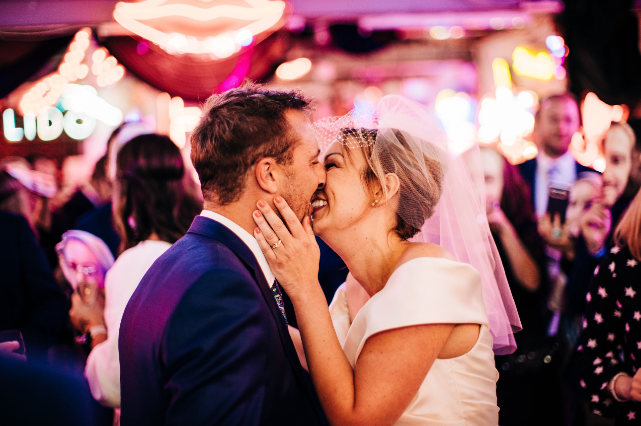 Candid wedding moment with the couple celebrating
